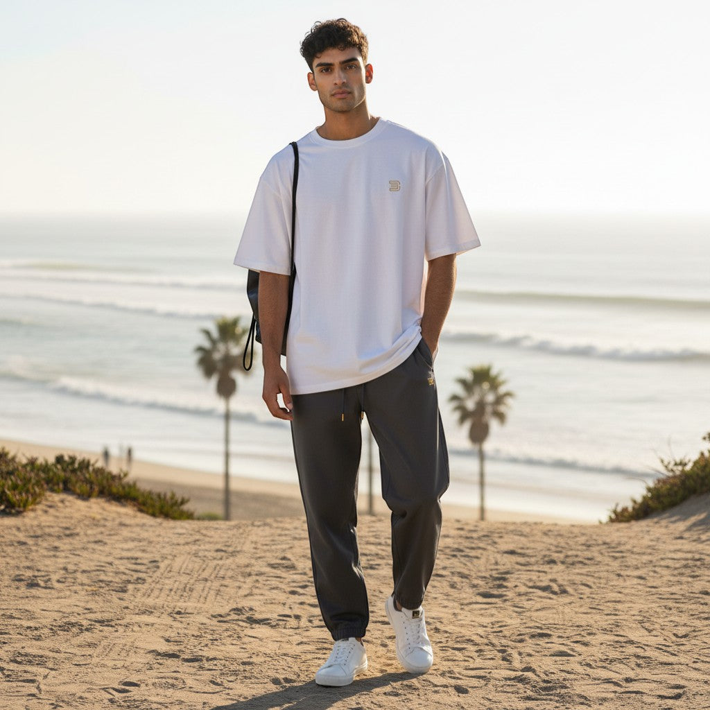 BeachBodyz® white oversized cotton t-shirt with a small gold logo on the chest.
