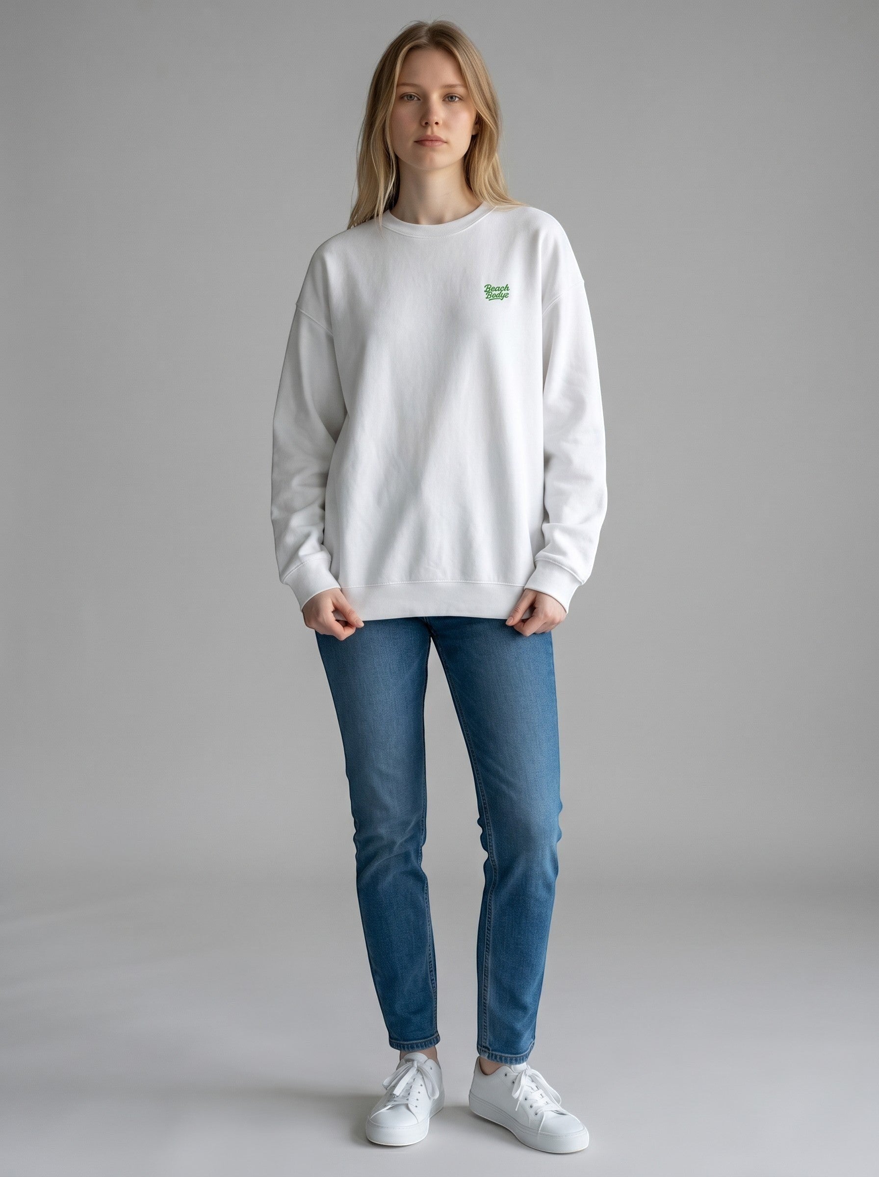 BeachBodyz® white oversized sweatshirt made from organic cotton with a small green embroidered logo on the chest.