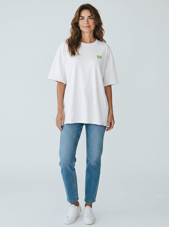 BeachBodyz® white oversized t-shirt made from organic cotton with a small green embroidered logo on the chest.