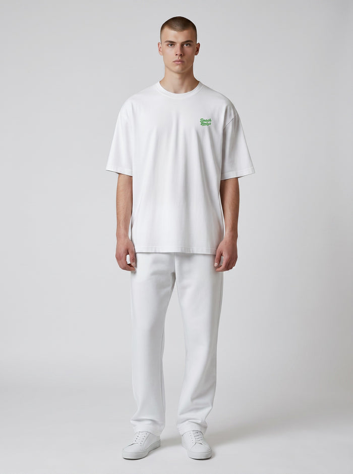 BeachBodyz® white oversized t-shirt made from organic cotton with a small green embroidered logo on the chest.